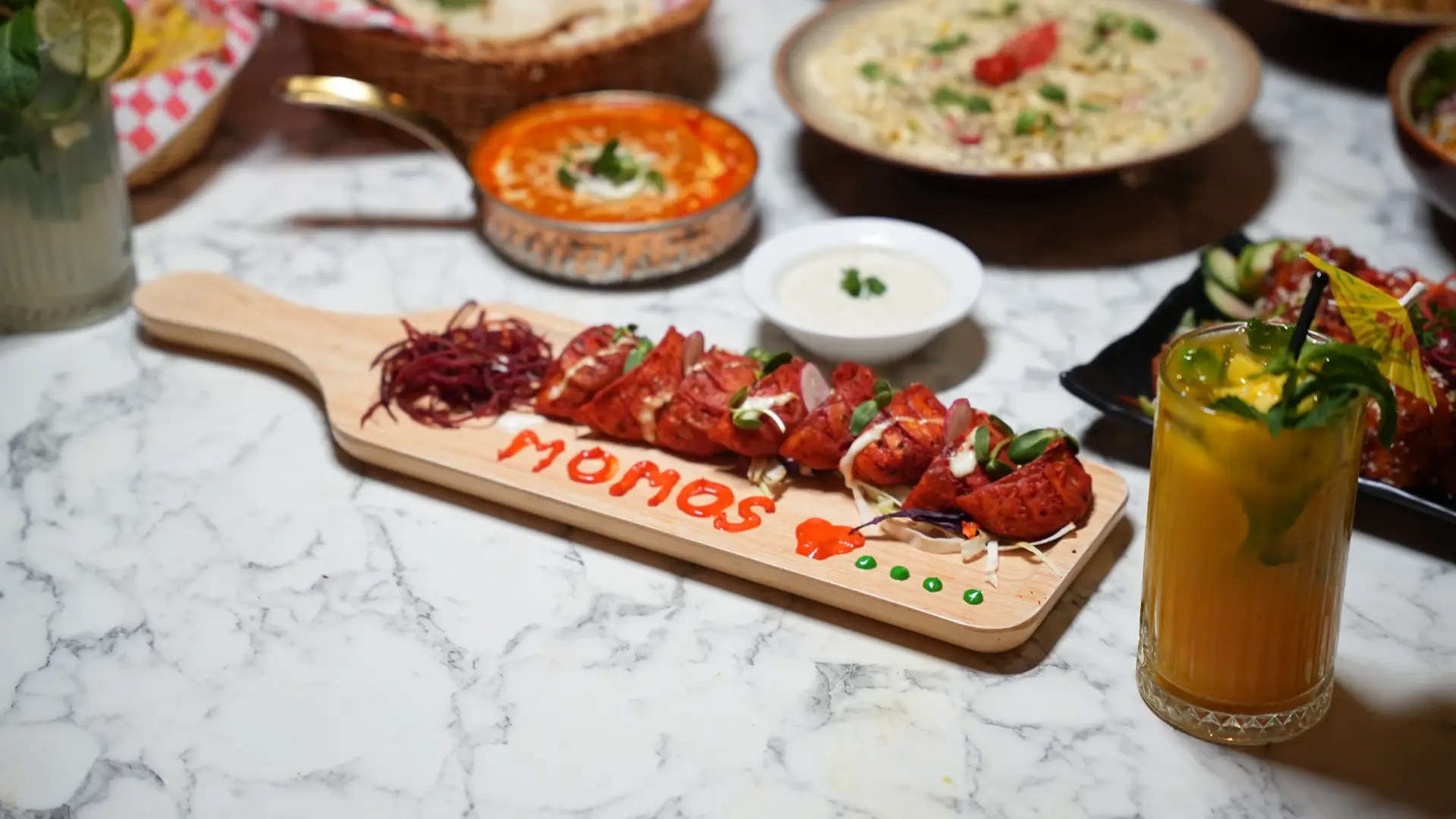 momos served with other dishes at punjabland brampton